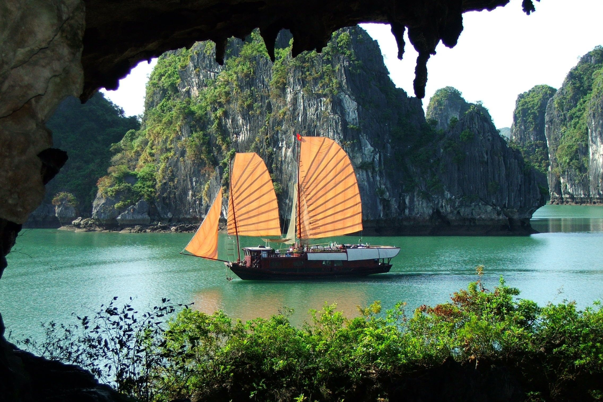 Cruise boat on calm waters of Ha Long Bay in September